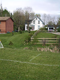 House bordering soccer field